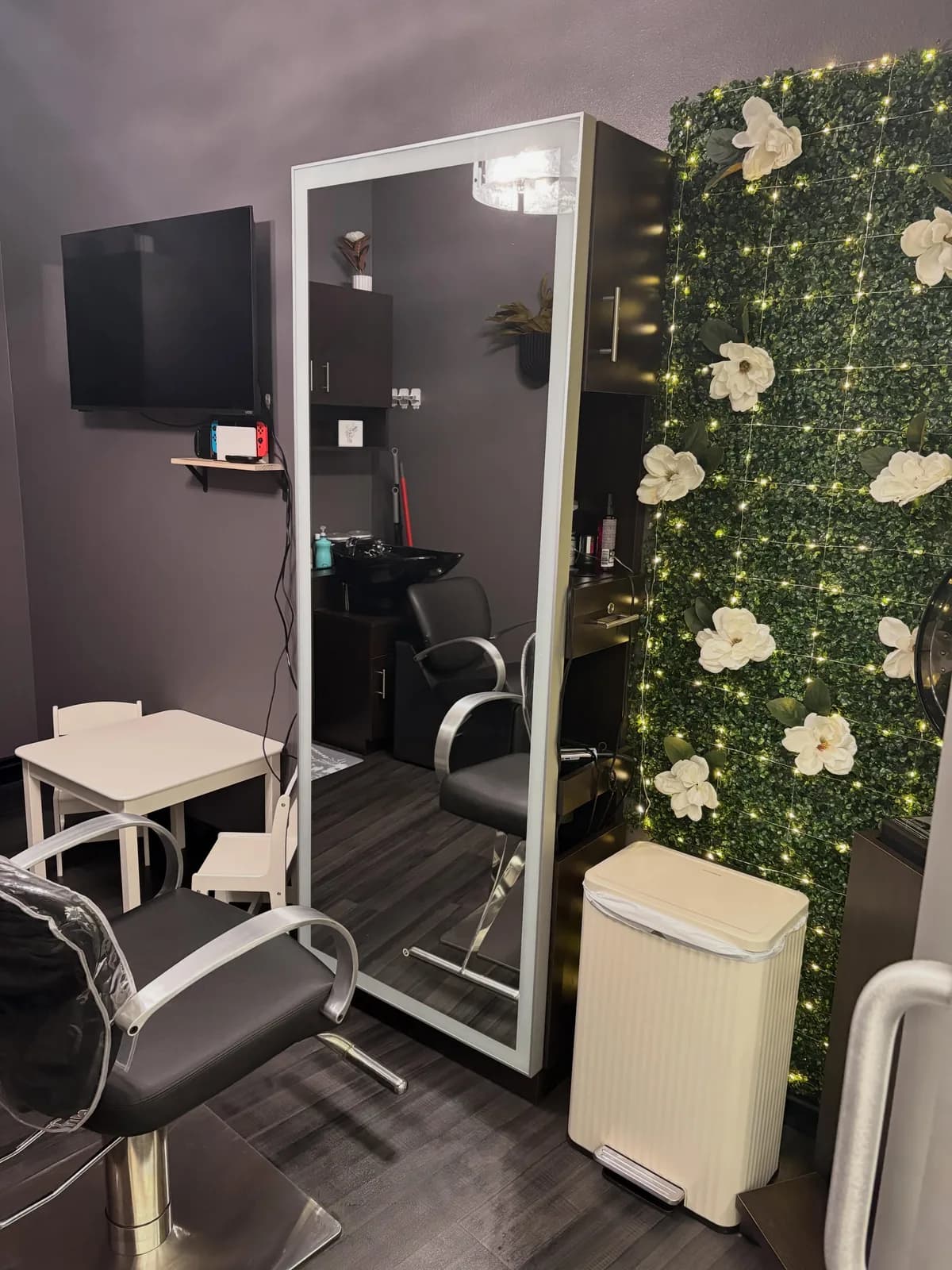The magnolia feature wall and styling station inside Magnolia Mane in Goodyear, AZ
